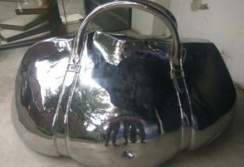 房地產(chǎn)提包雕塑廠(chǎng)家 公園擺件 鏡面不銹鋼提包雕塑生產(chǎn)