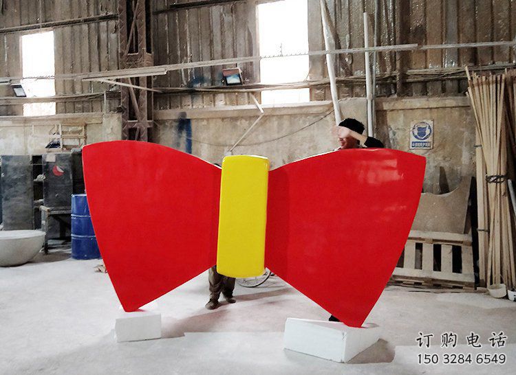 烤漆蝴蝶結(jié)雕塑廠家 現(xiàn)代創(chuàng)意小品 戶外蝴蝶結(jié)雕塑價格